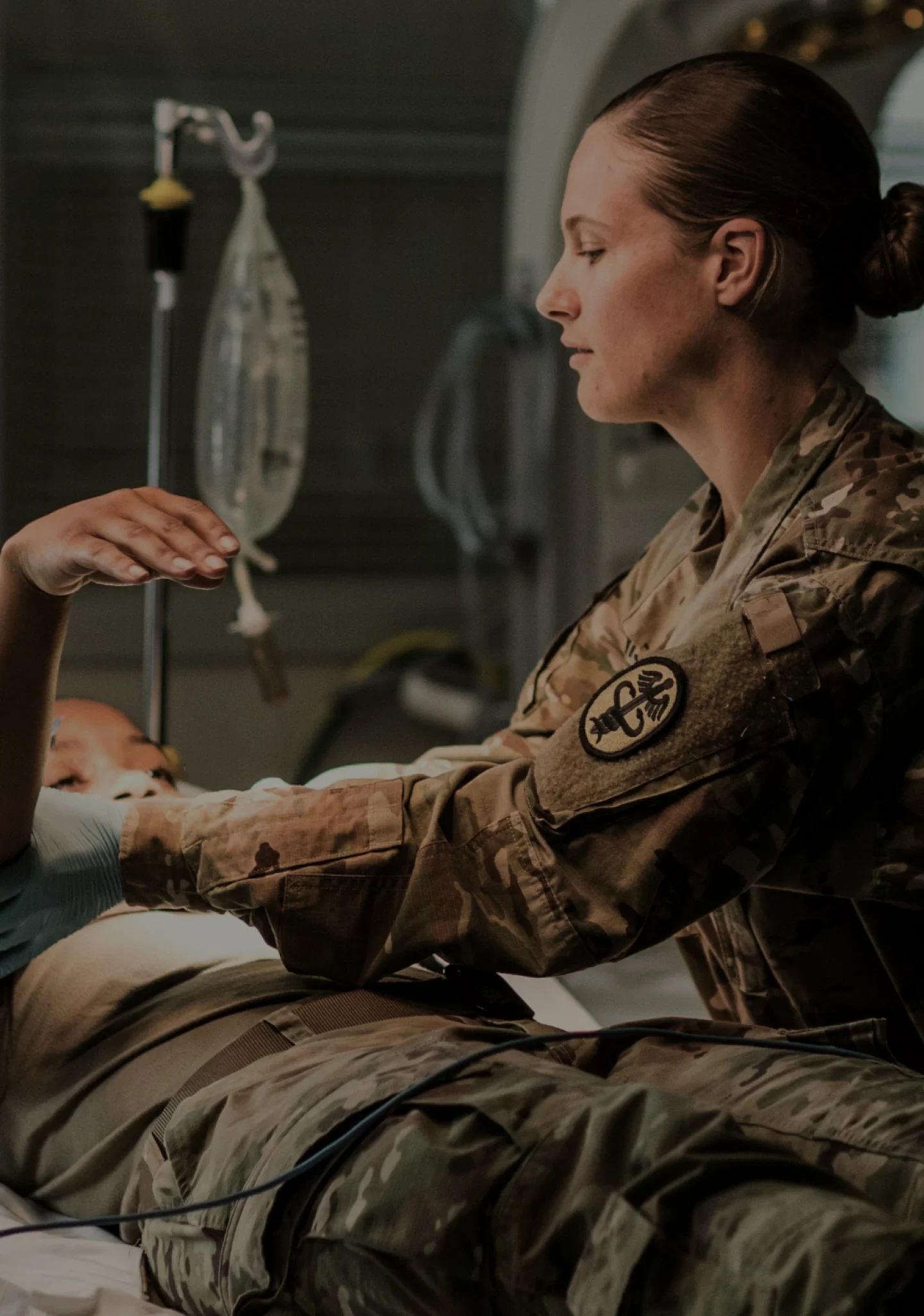 An Army healthcare worker treating a patient